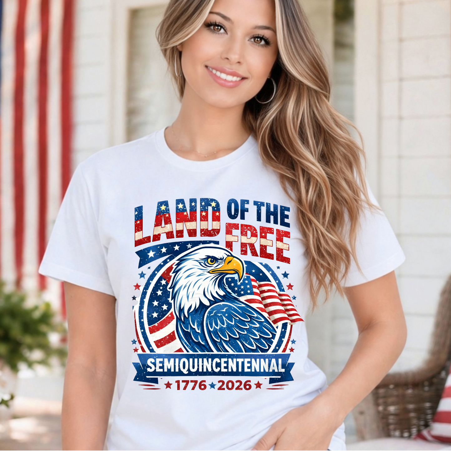 Woman wearing a white t-shirt with an eagle graphic and text in front of an American flag.