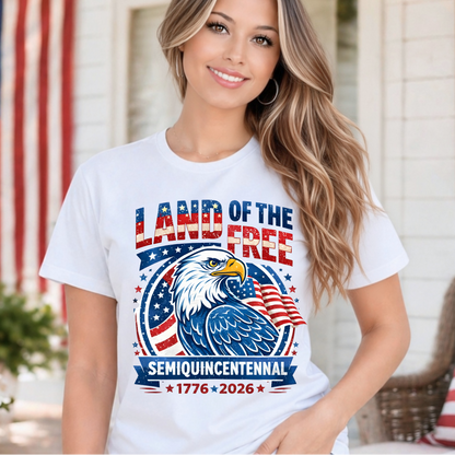 Woman wearing a white t-shirt with an eagle graphic and text in front of an American flag.