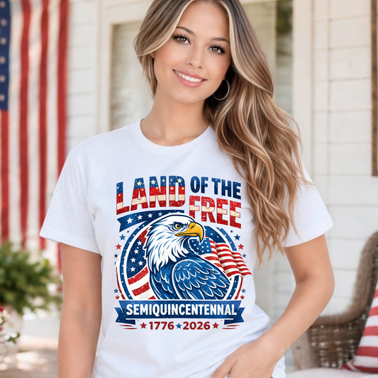 Woman wearing a white t-shirt with an eagle graphic and text in front of an American flag.