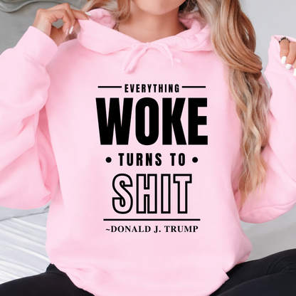 Pink hoodie with text 'Everything Woke Turns to Shit' by Donald J. Trump