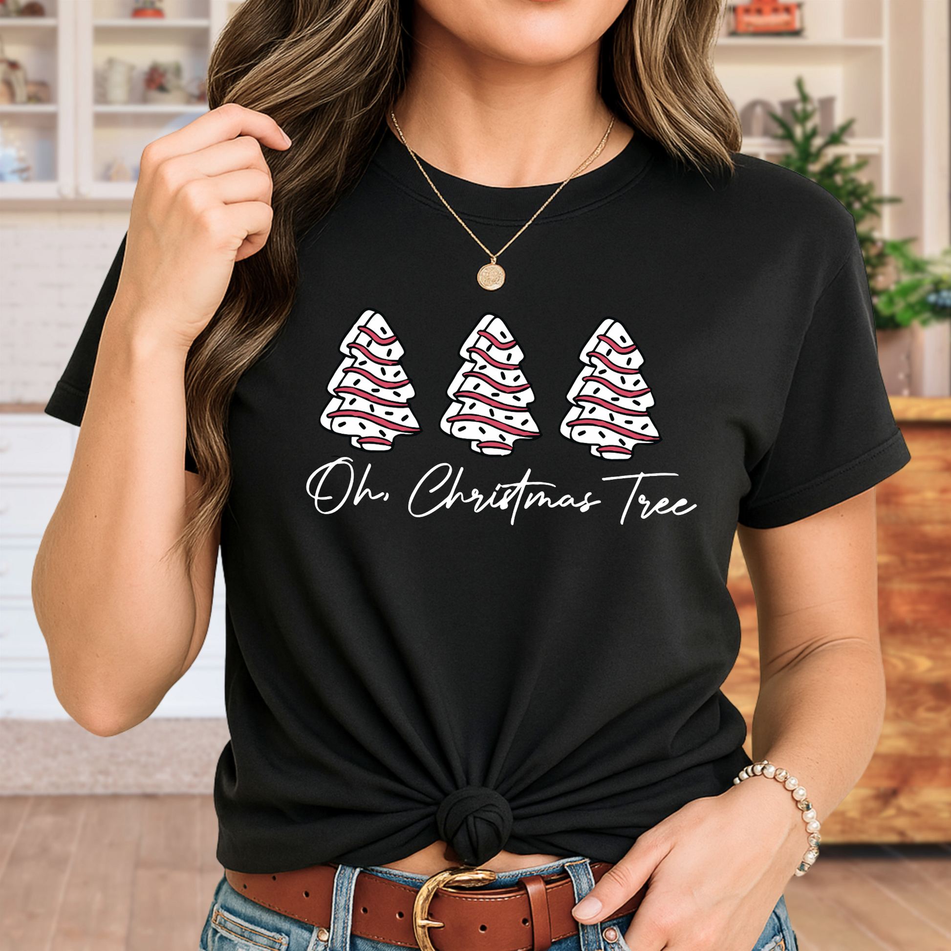 Stylish woman wearing a Black “Oh Christmas Tree” women’s unisex Christmas t-shirt with fun holiday tree design.