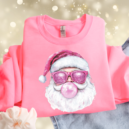 Pink sweatshirt flat lay with printed bubblegum Santa pink glitter-look design