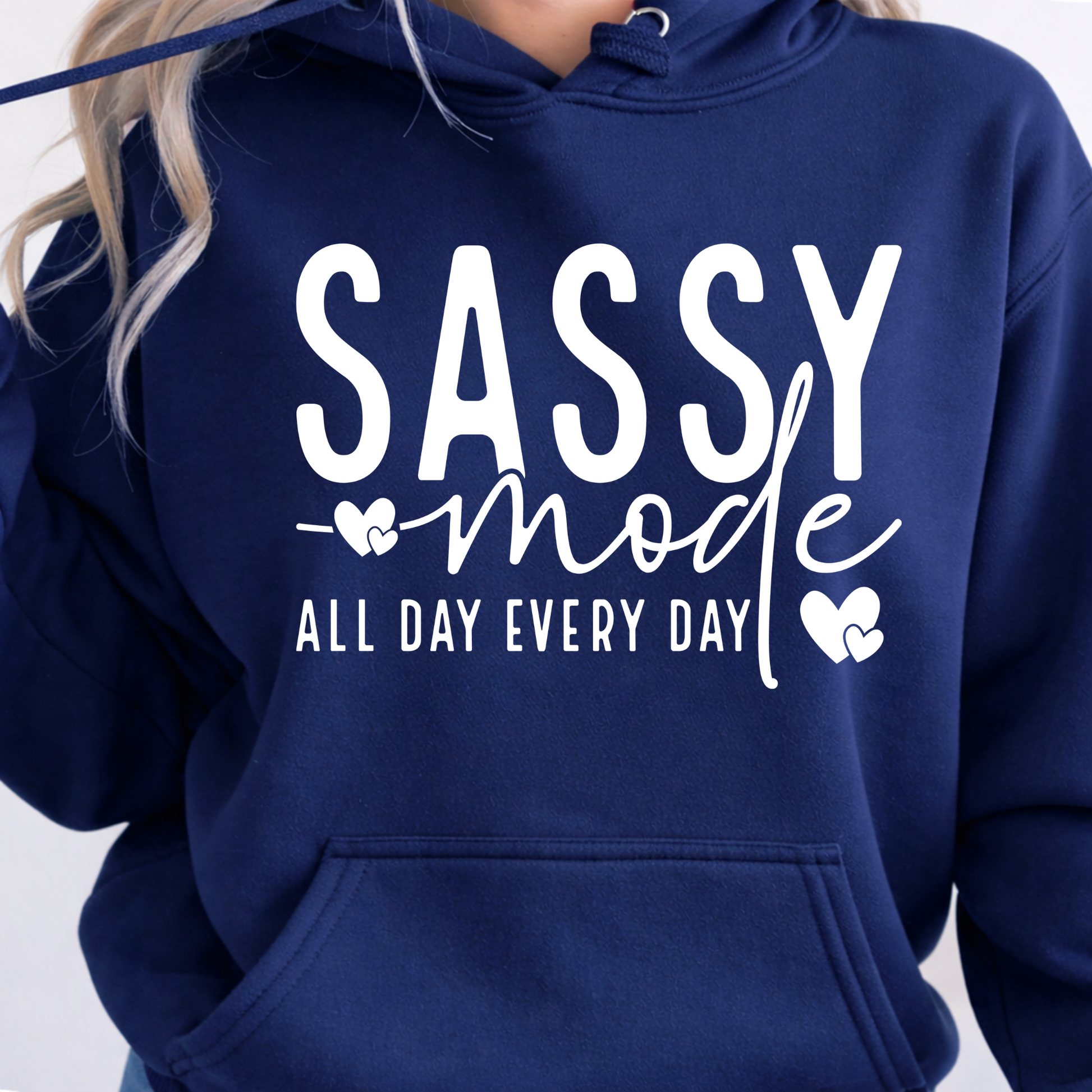Navy blue hoodie with 'Sassy mode all day every day' text on a plain background