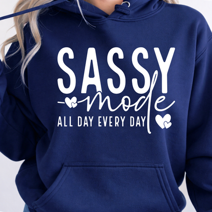 Navy blue hoodie with 'Sassy mode all day every day' text on a plain background