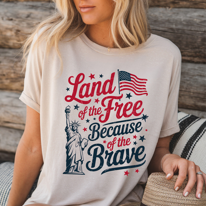 Woman lounging in light sand shirt with bold patriotic text
