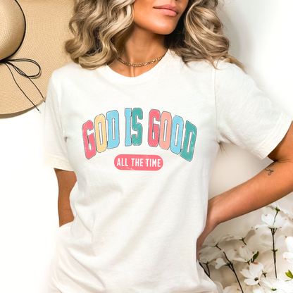 Woman wearing a white ‘God Is Good All The Time’ t-shirt