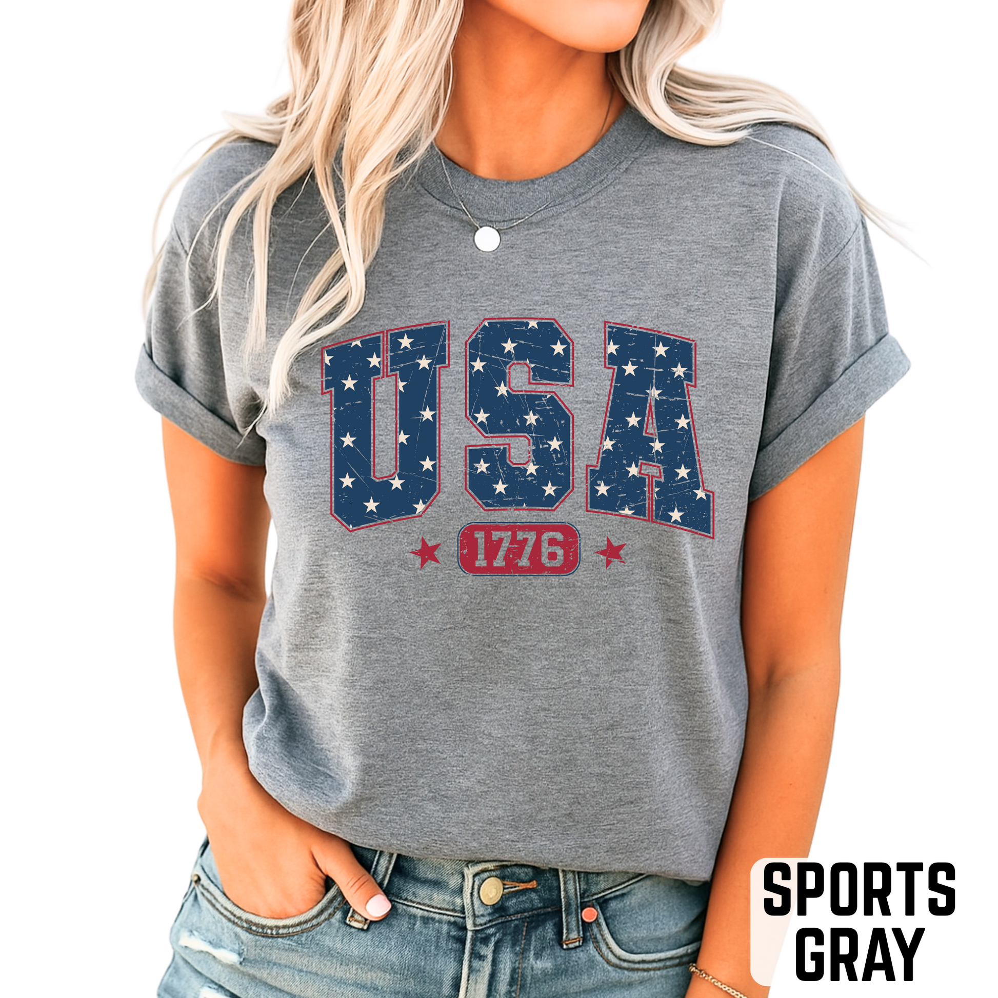 Light pink USA 1776 T-shirt with vintage navy and red patriotic graphic, styled for summer with a cozy boho background