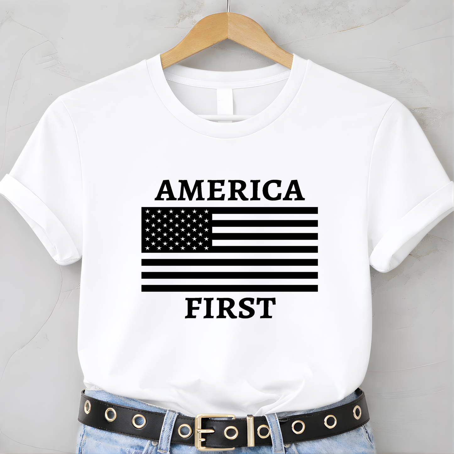 White America First patriotic women’s unisex t-shirt with black American flag graphic on hanger