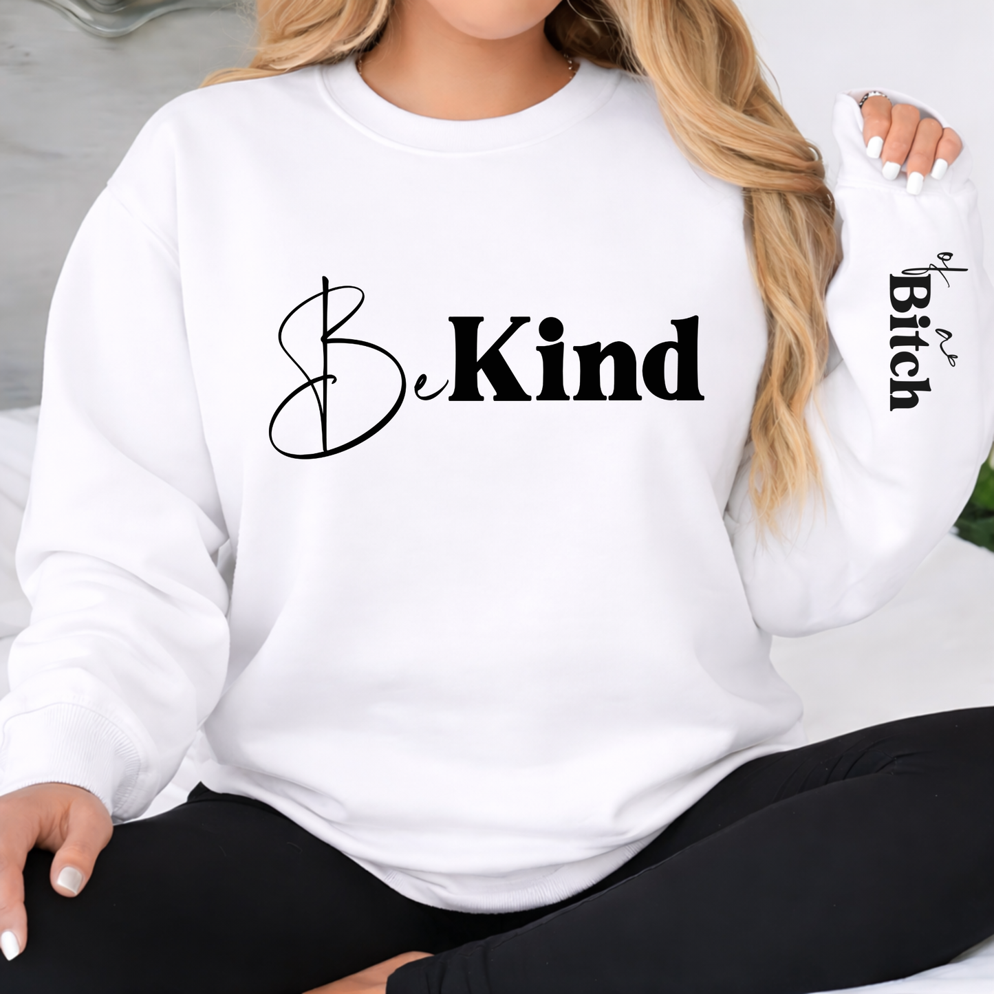 White Be Kind sweatshirt with clean front design and sleeve detail