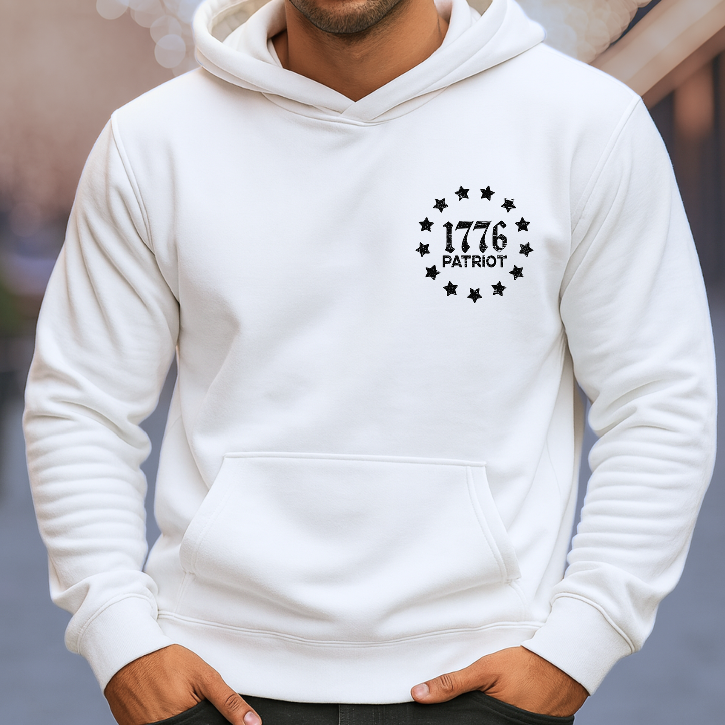 White hoodie with '1776 Patriot' design on a blurred background