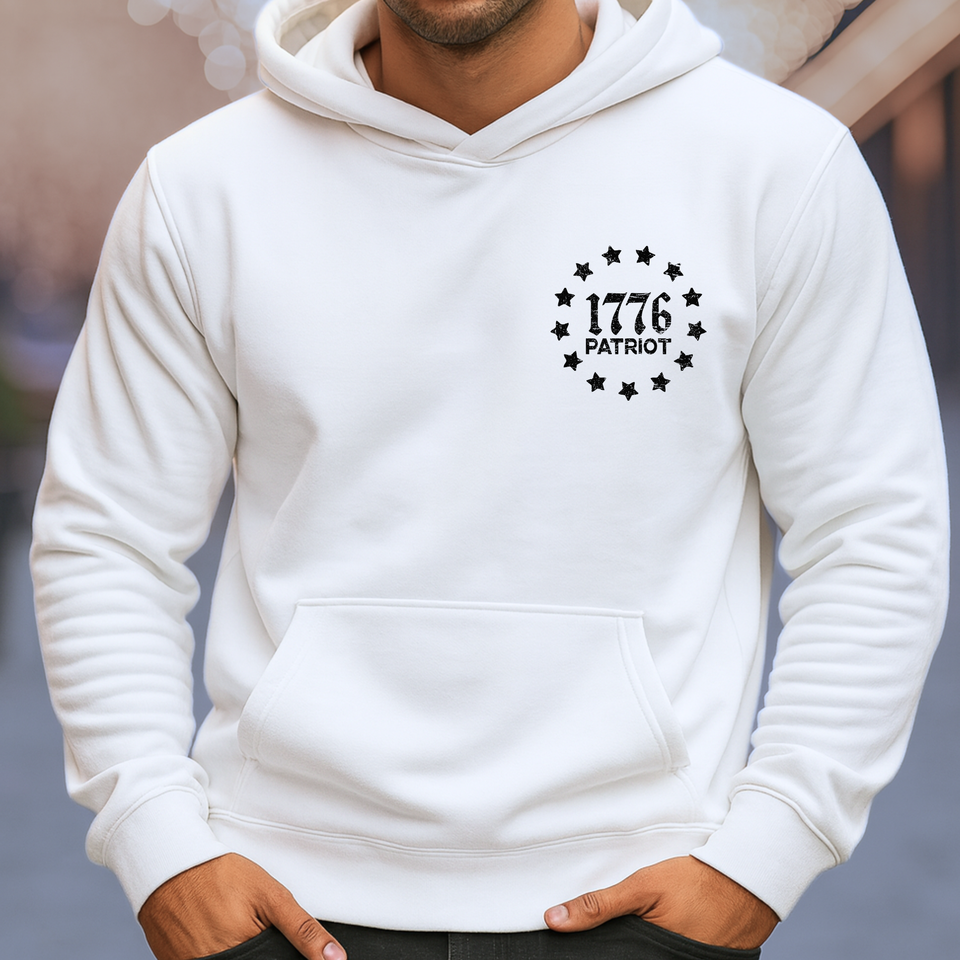 White hoodie with '1776 Patriot' design on a blurred background