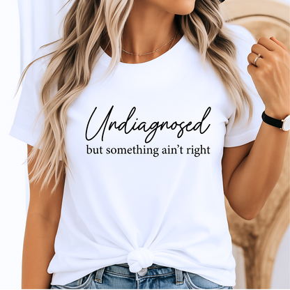 White shirt styled with jeans, script quote in black text

