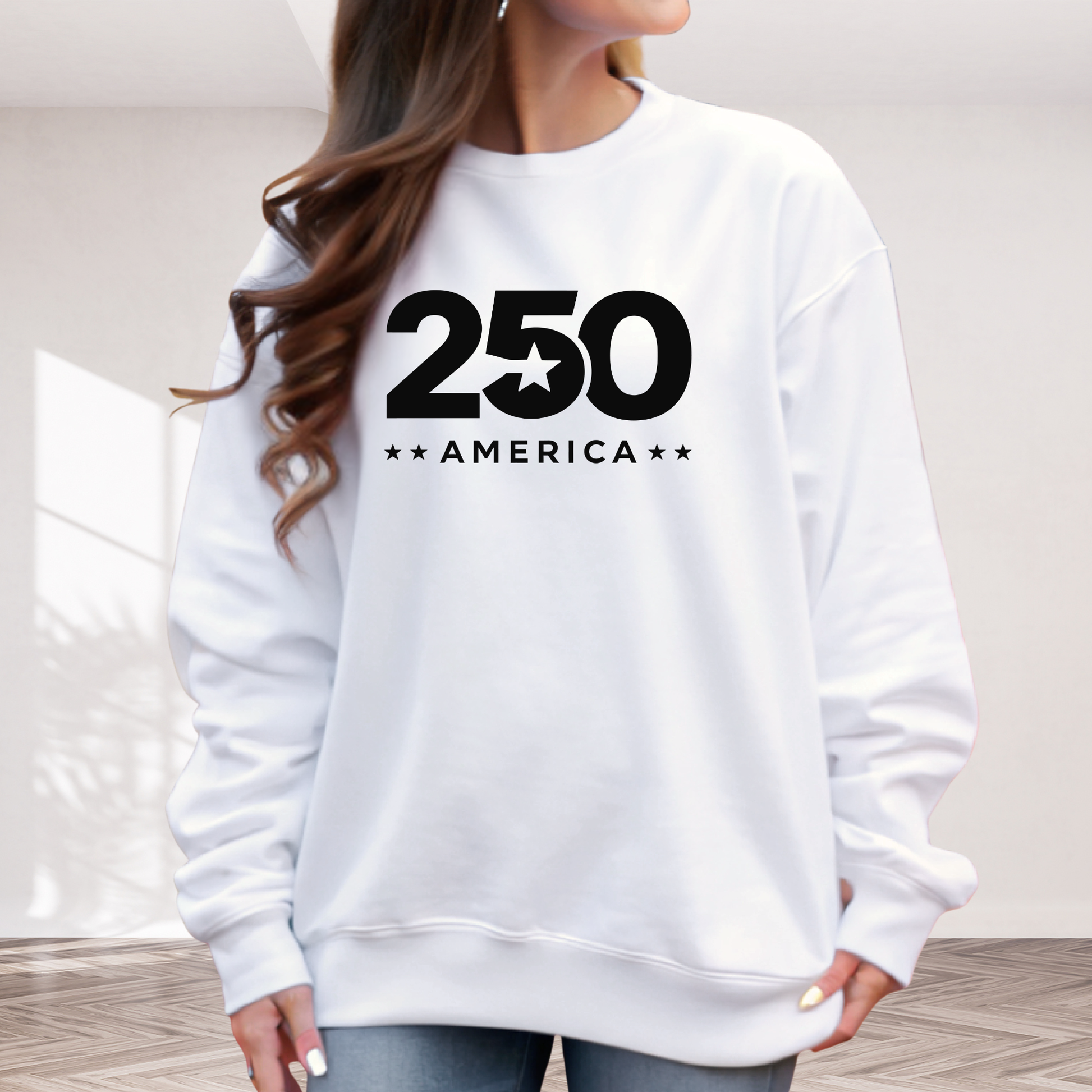 White sweatshirt with '250 America' text worn by a person indoors.