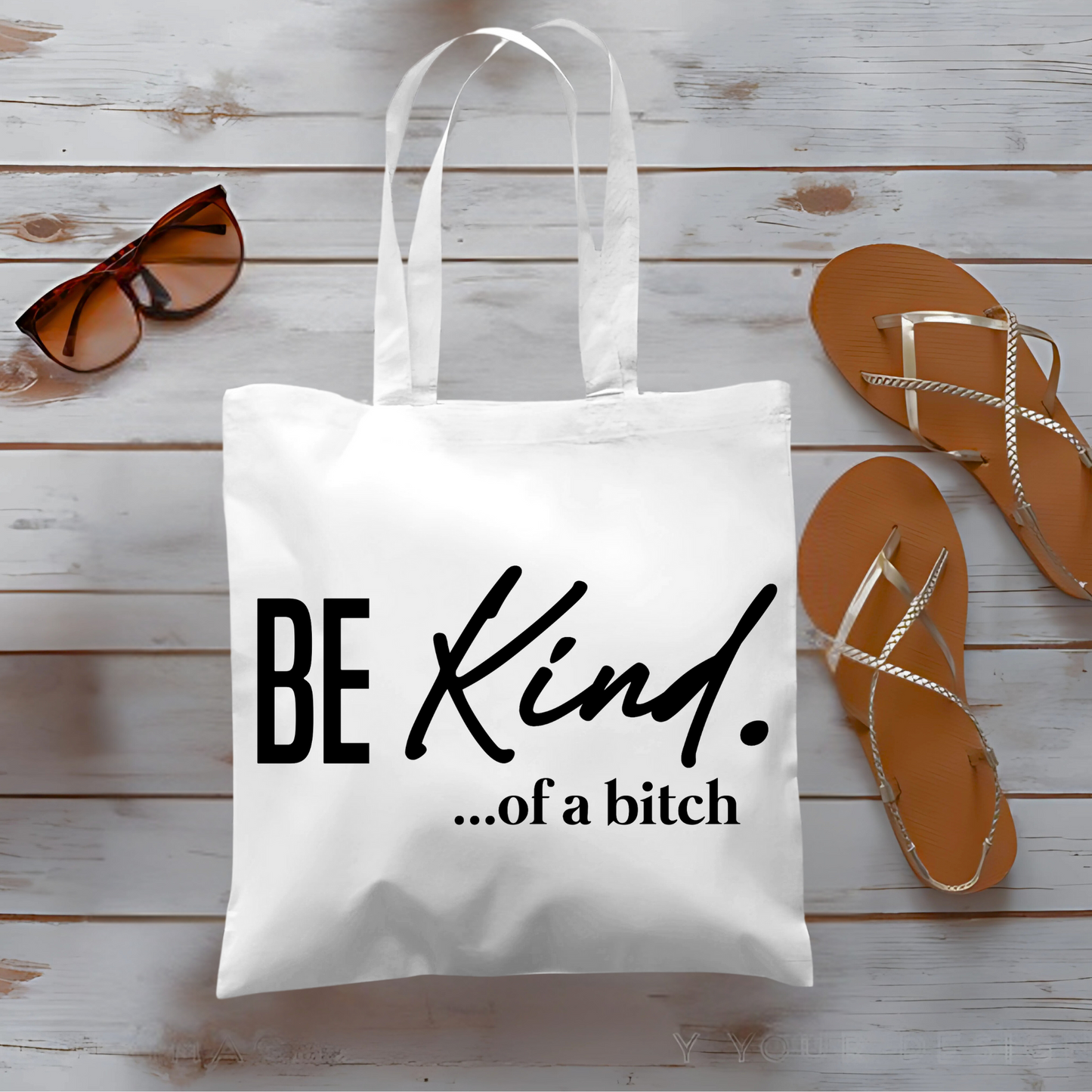 White tote bag flat lay with sandals and sunglasses, funny text design