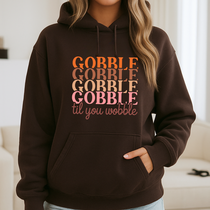 Woman in dark brown hoodie with autumn-inspired print – festive and cute turkey day look