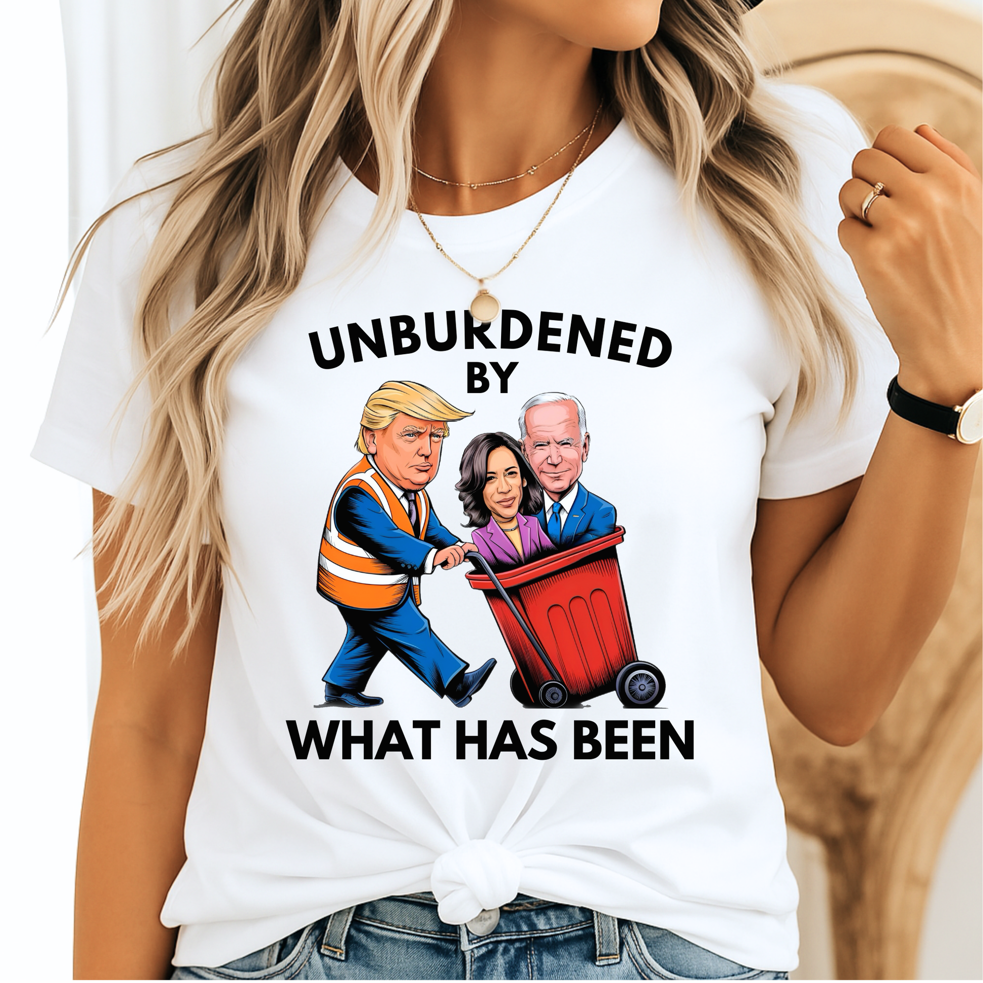 Woman in white knotted tee showing Trump pushing Kamala and Biden in red garbage can – women’s conservative shirt