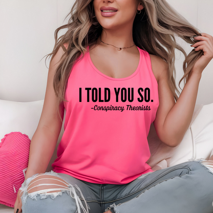 Woman sitting in ripped jeans and pink tank with quote "I Told You So"
