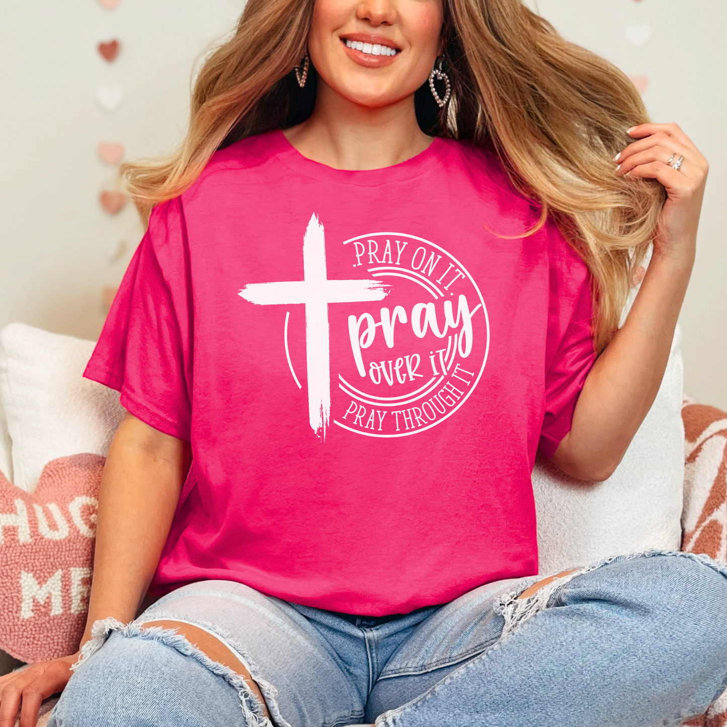 Woman wearing Dark Pink T-shirt with black cross graphic and inspirational pray wording.