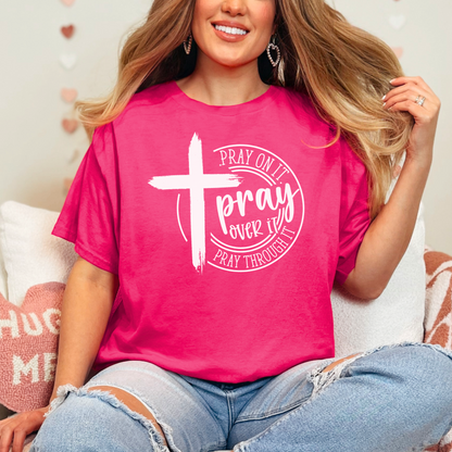 Woman wearing Dark Pink T-shirt with black cross graphic and inspirational pray wording.