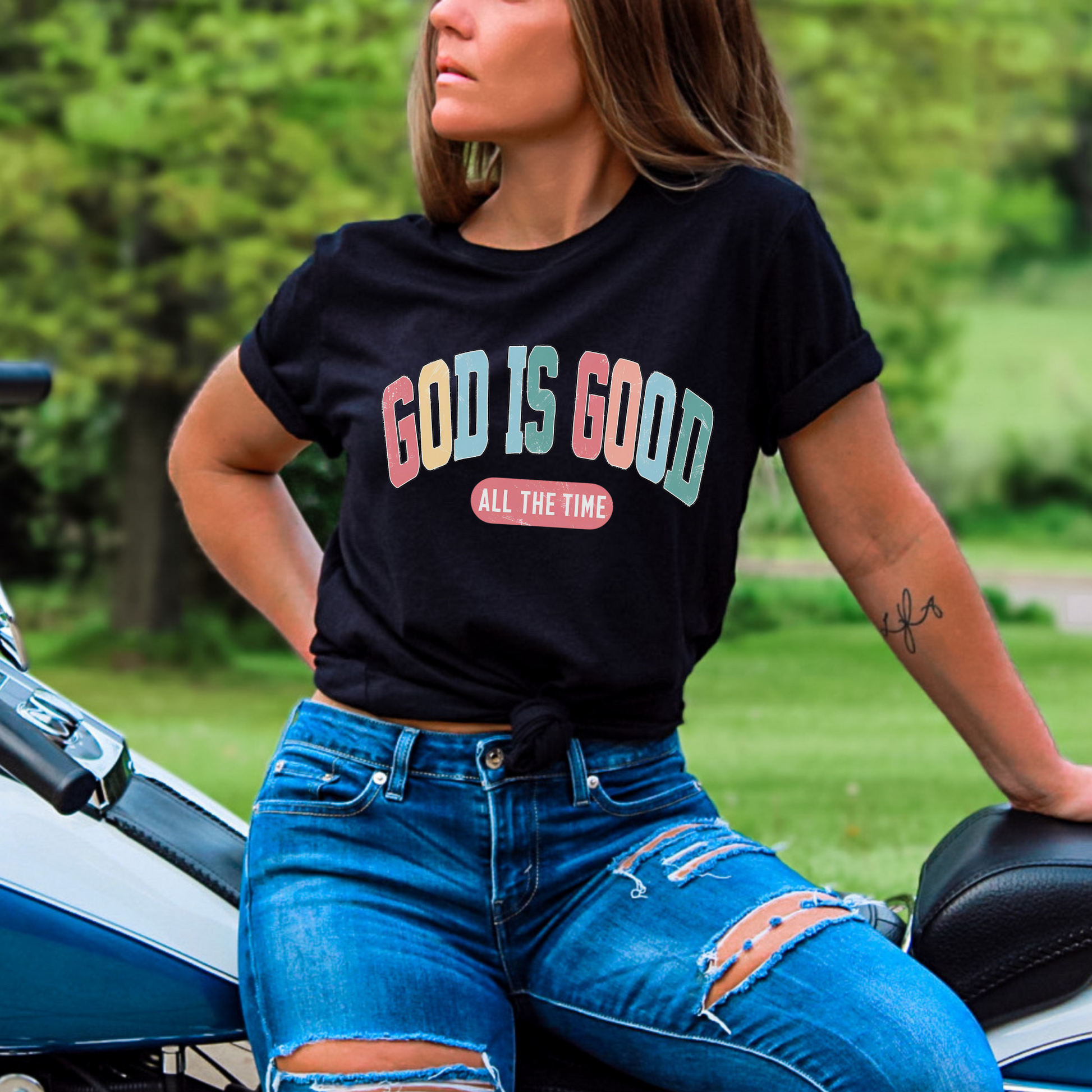 Woman wearing Black God Is Good All the Time graphic T-shirt