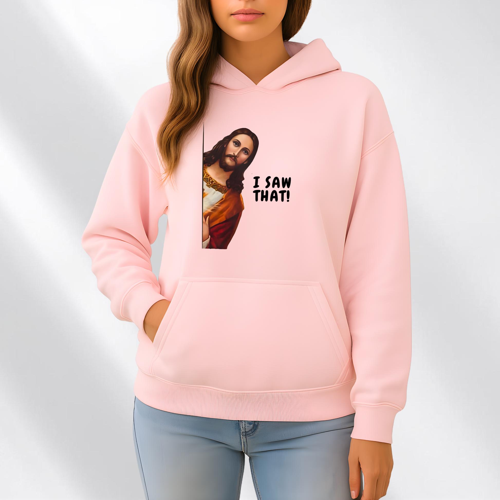 Woman wearing I Saw That funny Jesus graphic hoodie in pink
