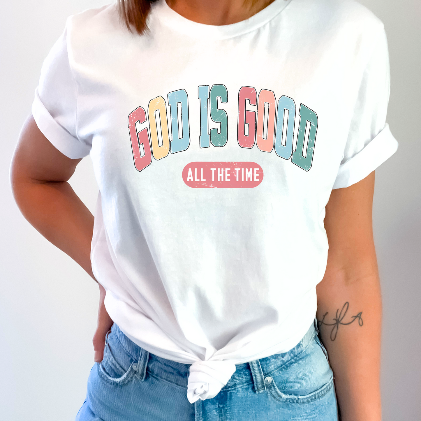 Woman wearing a ‘God Is Good All The Time’ t-shirt