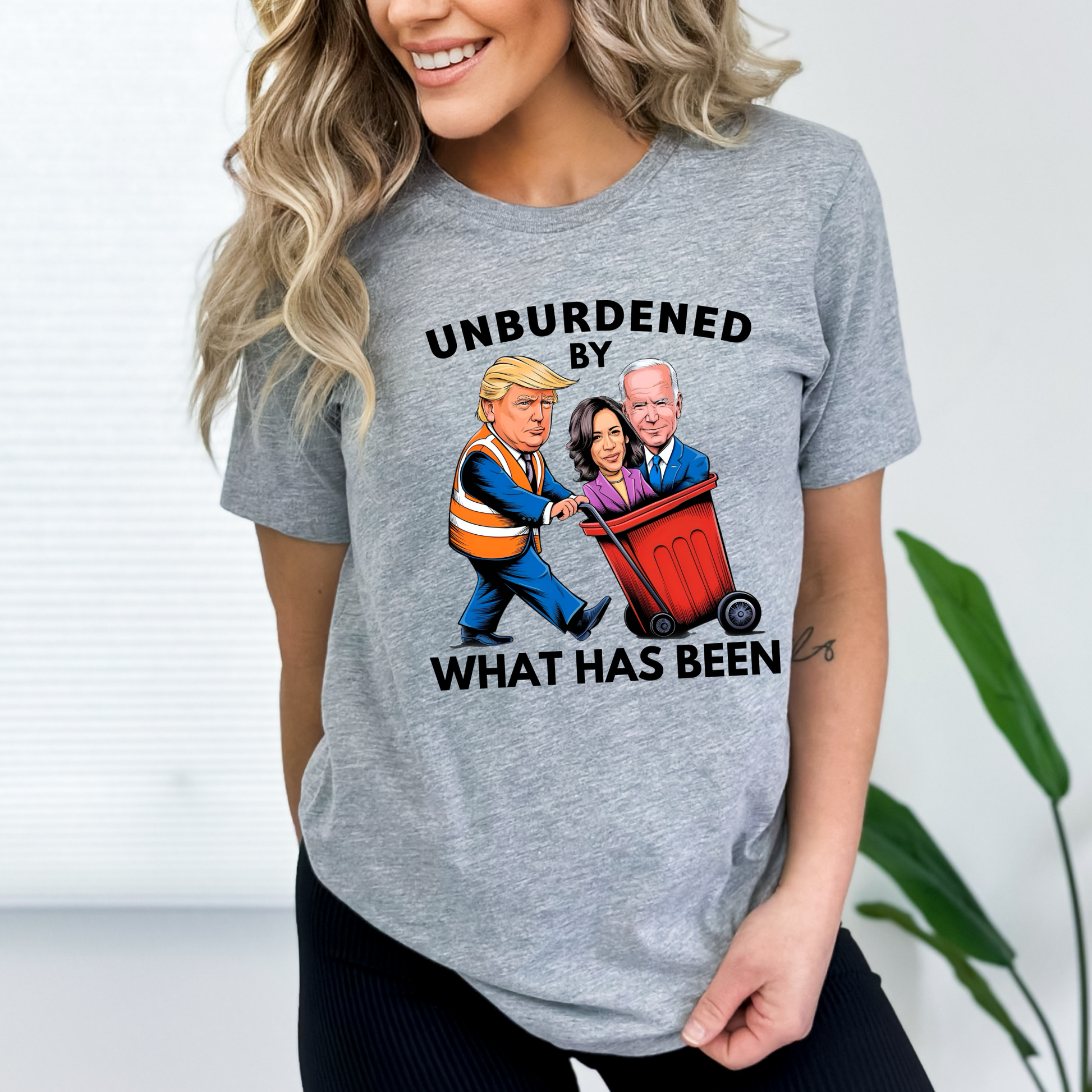 Gray  relaxed fit shirt with cartoon Trump throwing away Biden and Kamala – women's political statement tee