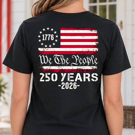 Woman wearing a black America 250 t-shirt with a design celebrating 250 years since 1776.