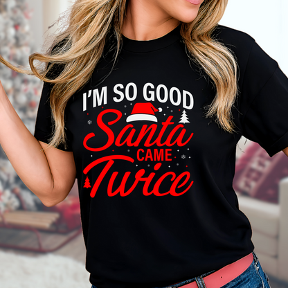 Woman wearing a black “I’m So Good Santa Came Twice” Christmas T-shirt, funny holiday graphic tee for women, perfect for festive parties and gifts.