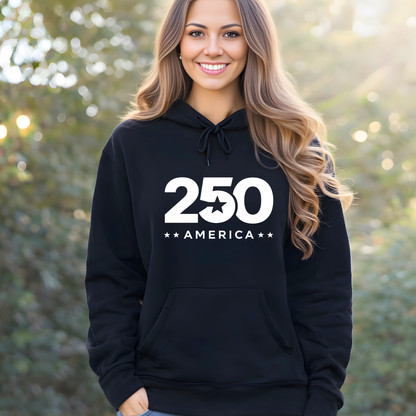 Woman wearing a black hoodie with '250 America' printed on it, standing outdoors.