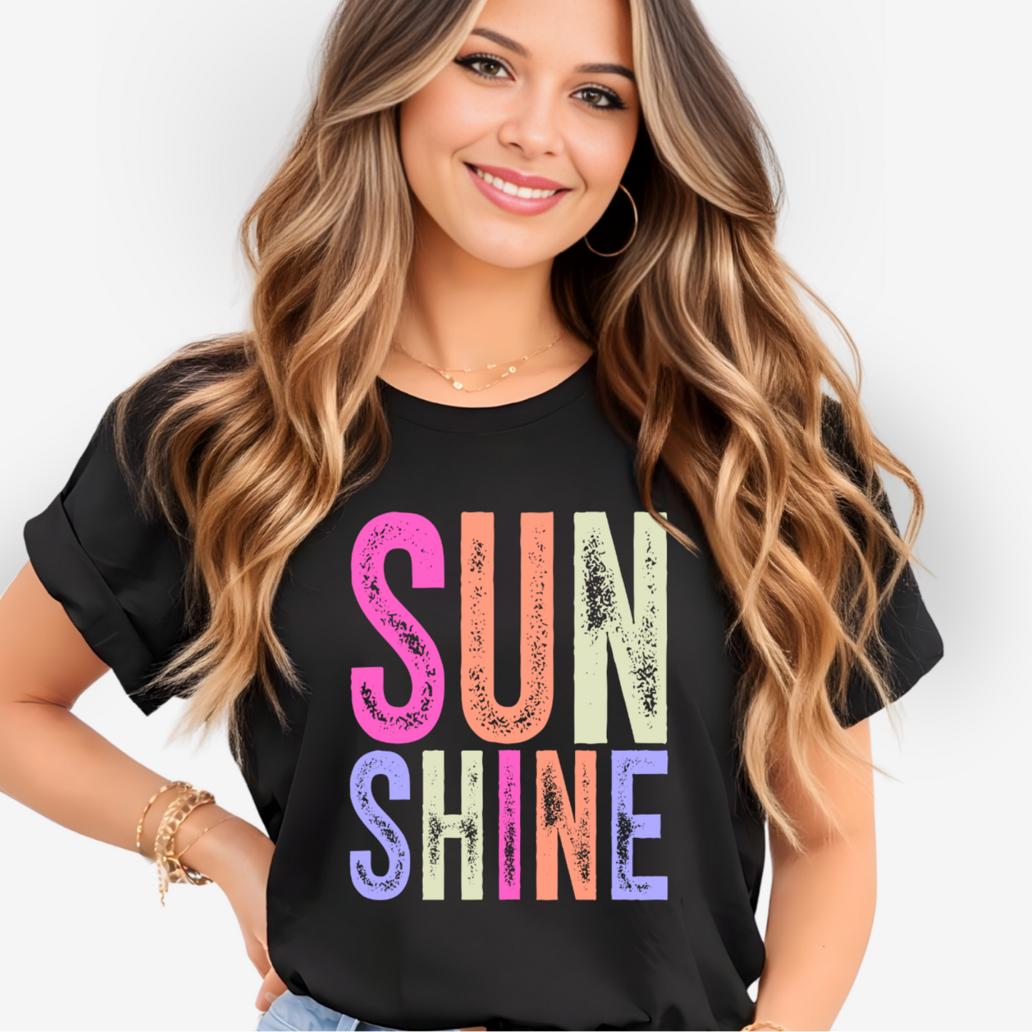 Woman wearing a black t-shirt with 'SUN SHINE' in colorful letters on a white background