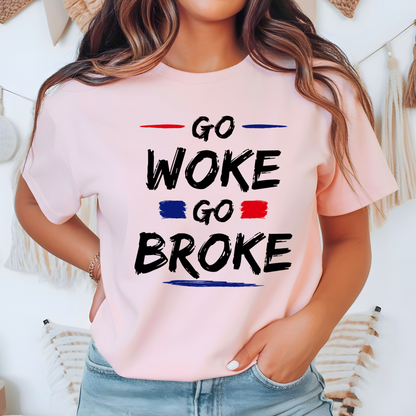 Woman wearing a light pink “Go Woke Go Broke” t-shirt with bold black, red, and blue lettering