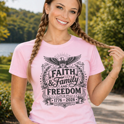Woman wearing a pink t-shirt with 'Faith & Family & Freedom' design outdoors.