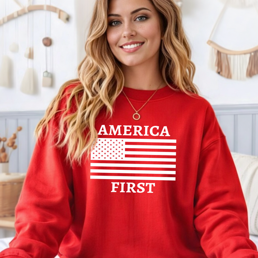 Woman wearing a red sweatshirt with 'AMERICA FIRST' text and American flag design.