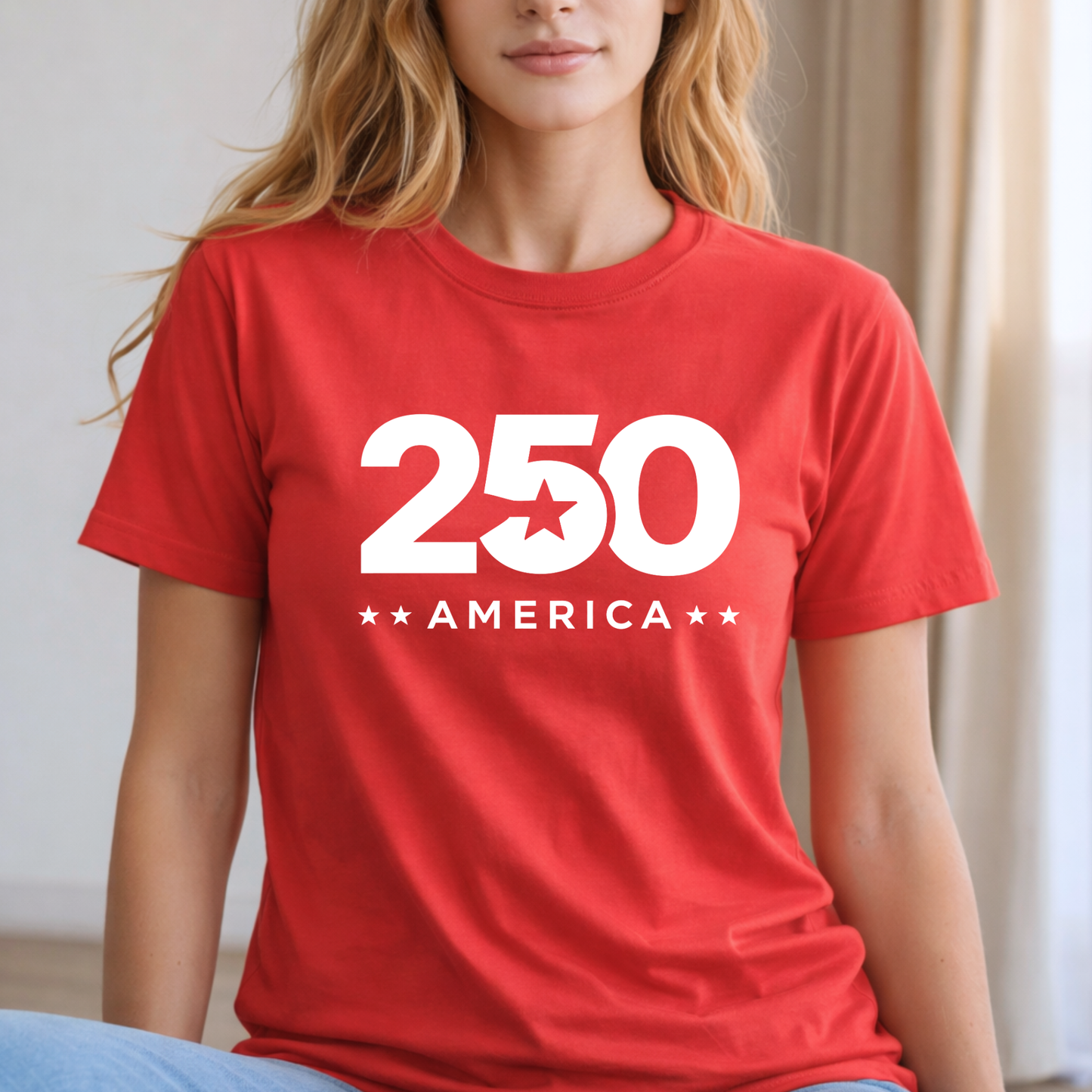 Woman wearing a red t-shirt with '250 America' printed on it.