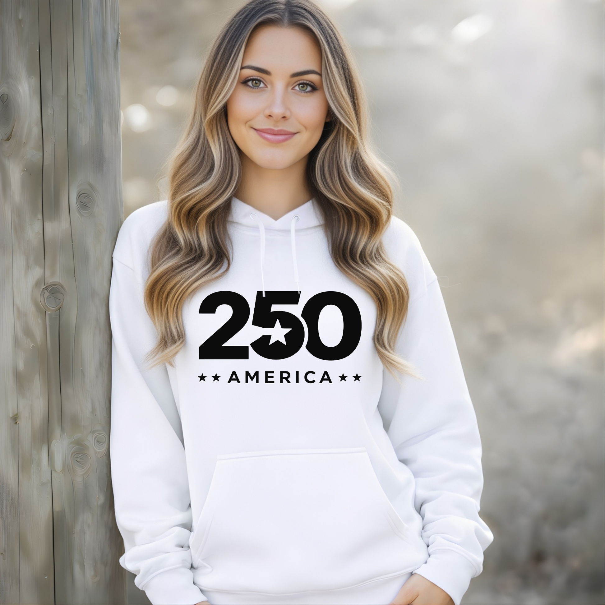 Woman wearing a white hoodie with '250 America' text against a wooden background