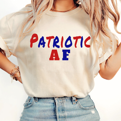 Woman wearing a white t-shirt with 'Patriotic AF' text in red, blue, and green on a plain background