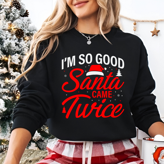 Woman wearing black “I’m So Good Santa Came Twice” Christmas sweatshirt

