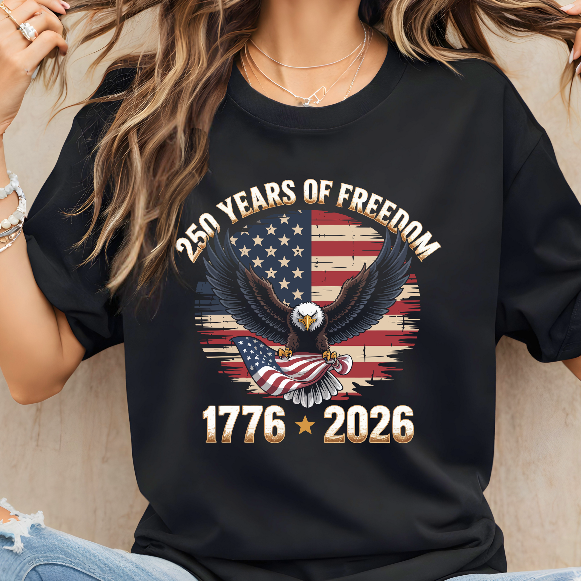 Woman wearing black patriotic t shirt with 1776–2026 eagle graphic