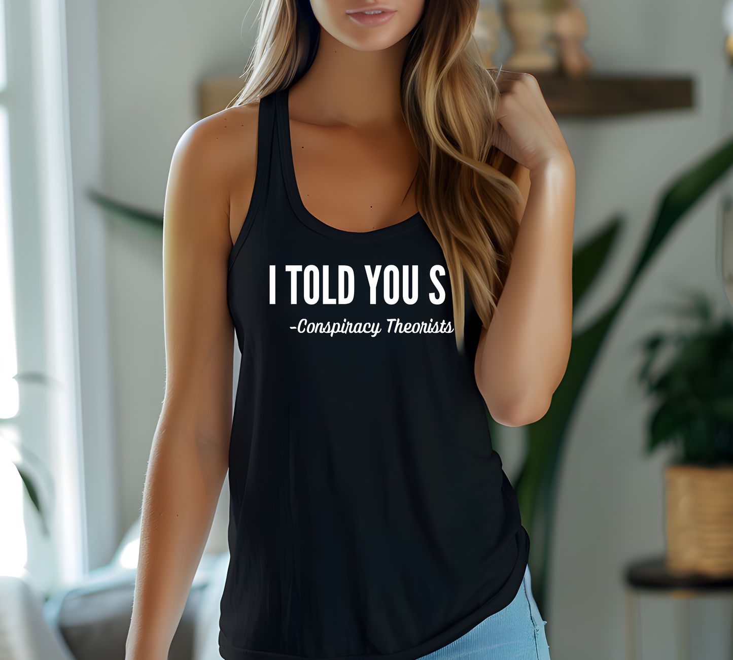 Woman wearing black racerback tank with "I Told You So - Conspiracy Theorists" quote