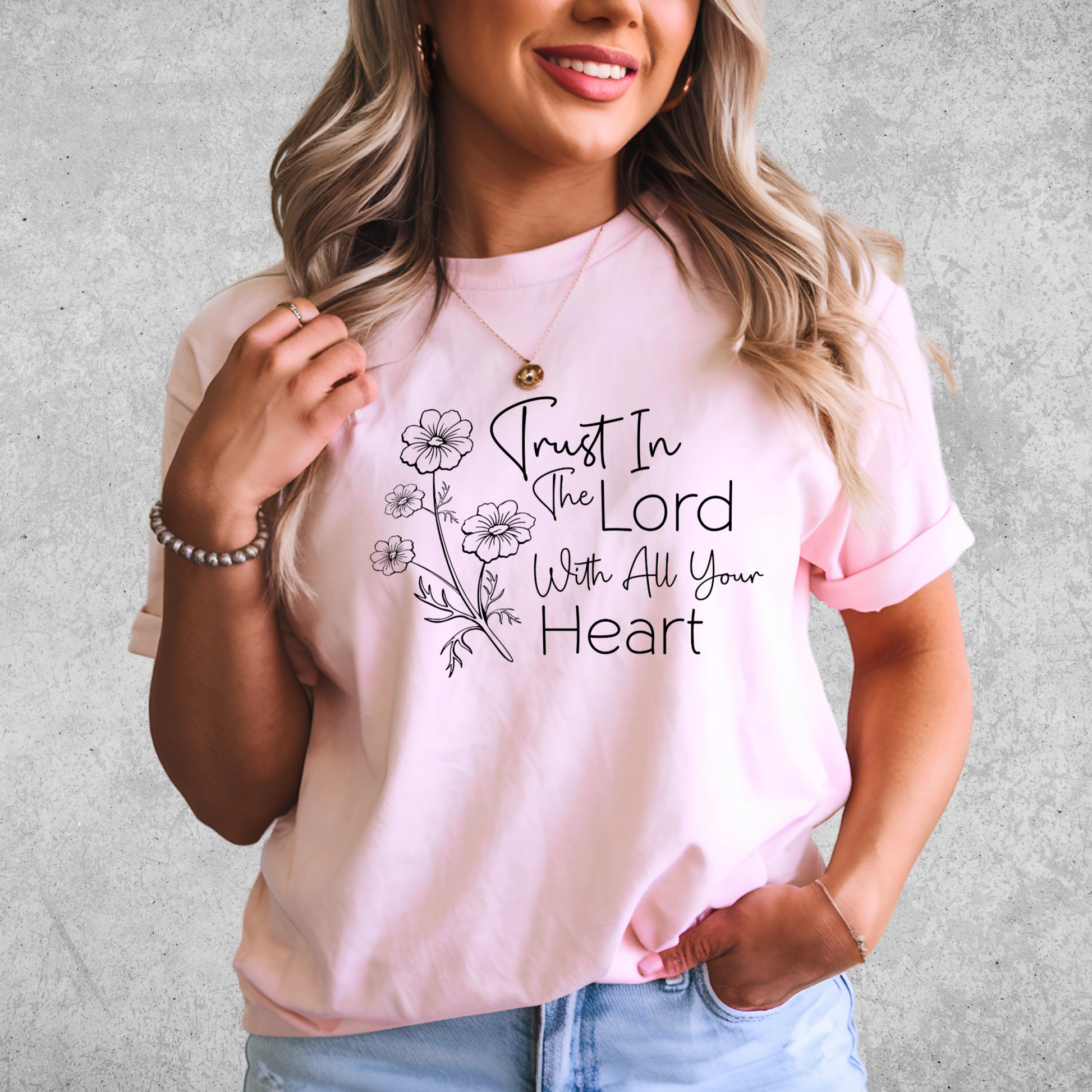 Close-up of faith-based women’s T-Shirt – floral “Trust in the Lord With All Your Heart” design