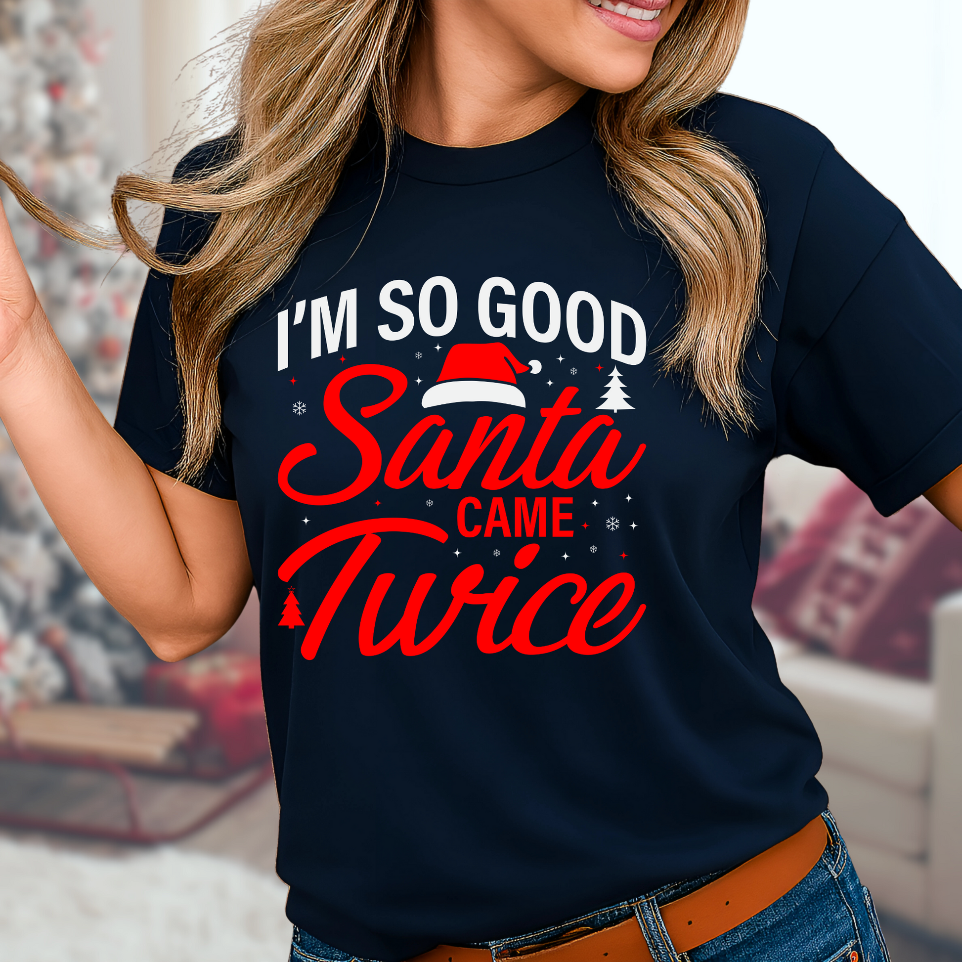 Woman wearing navy “I’m So Good Santa Came Twice” holiday graphic tee