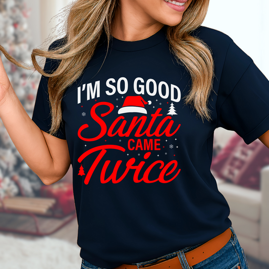 Woman wearing navy “I’m So Good Santa Came Twice” holiday graphic tee