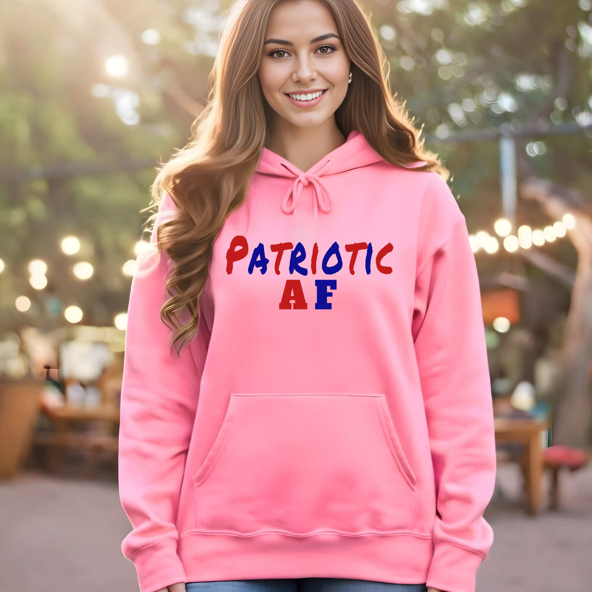 Woman wearing pink patriotic AF hoodie with red white and blue text