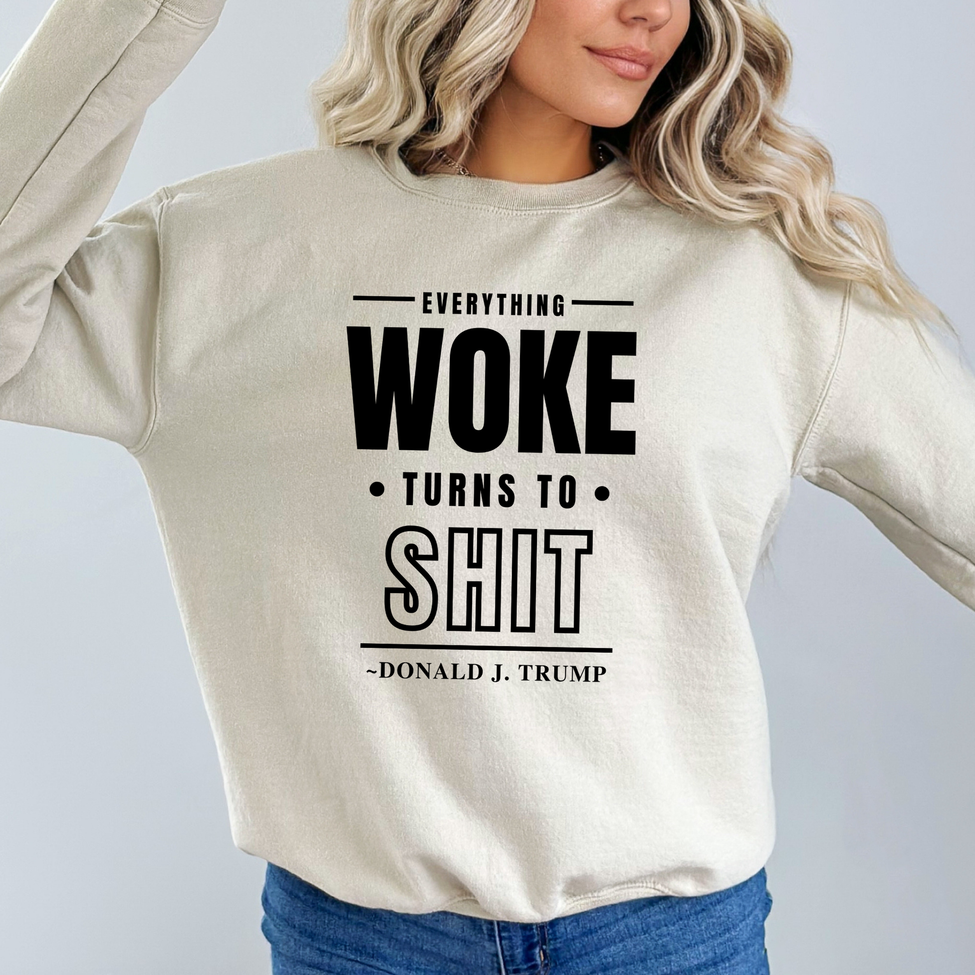 Woman wearing sand-colored sweatshirt with bold black print