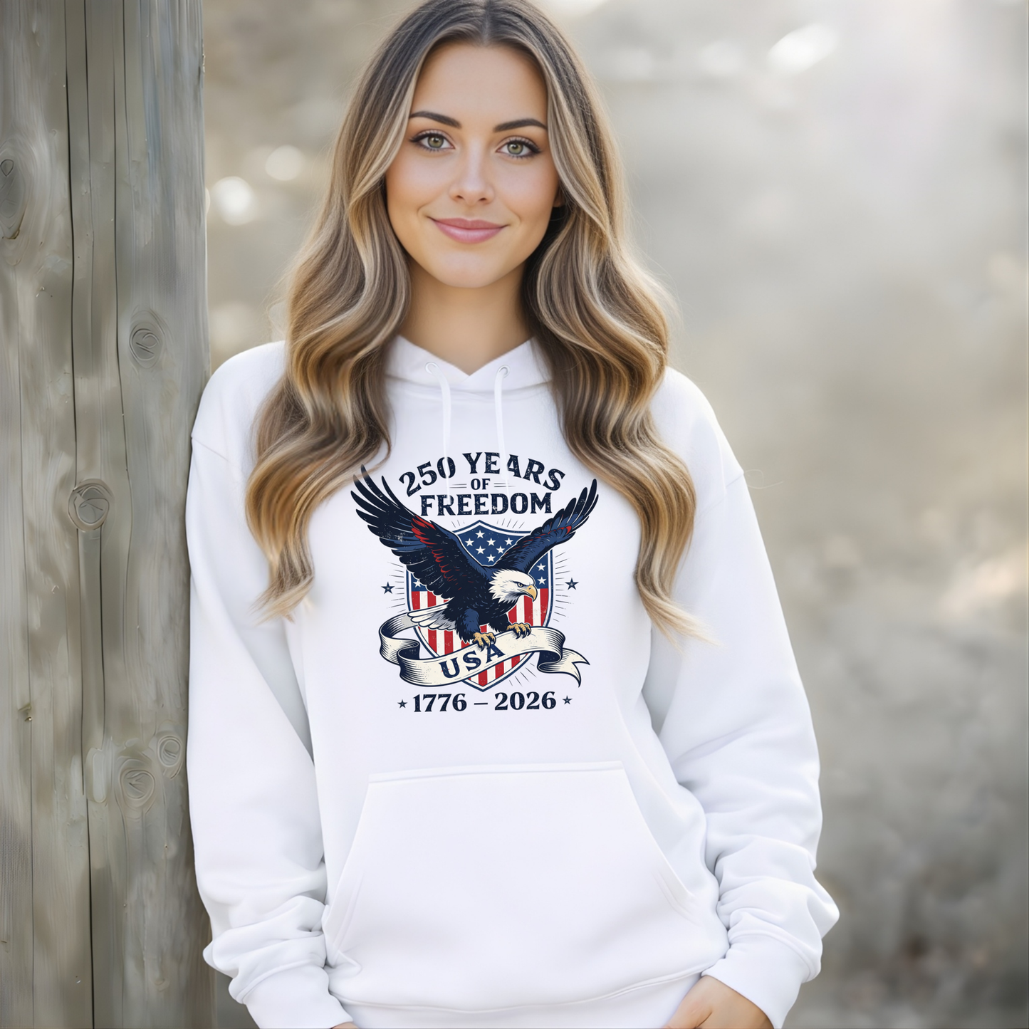 Woman wearing white hoodie America 250 patriotic eagle outdoor lifestyle