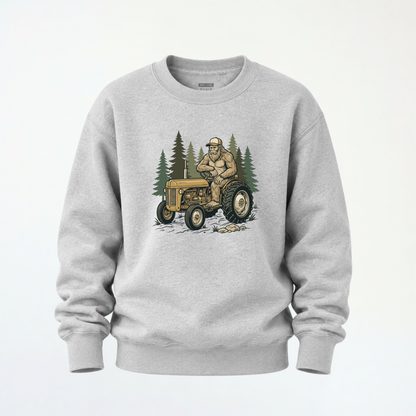 Sports gray youth crewneck sweatshirt mockup with a woodland tractor graphic.