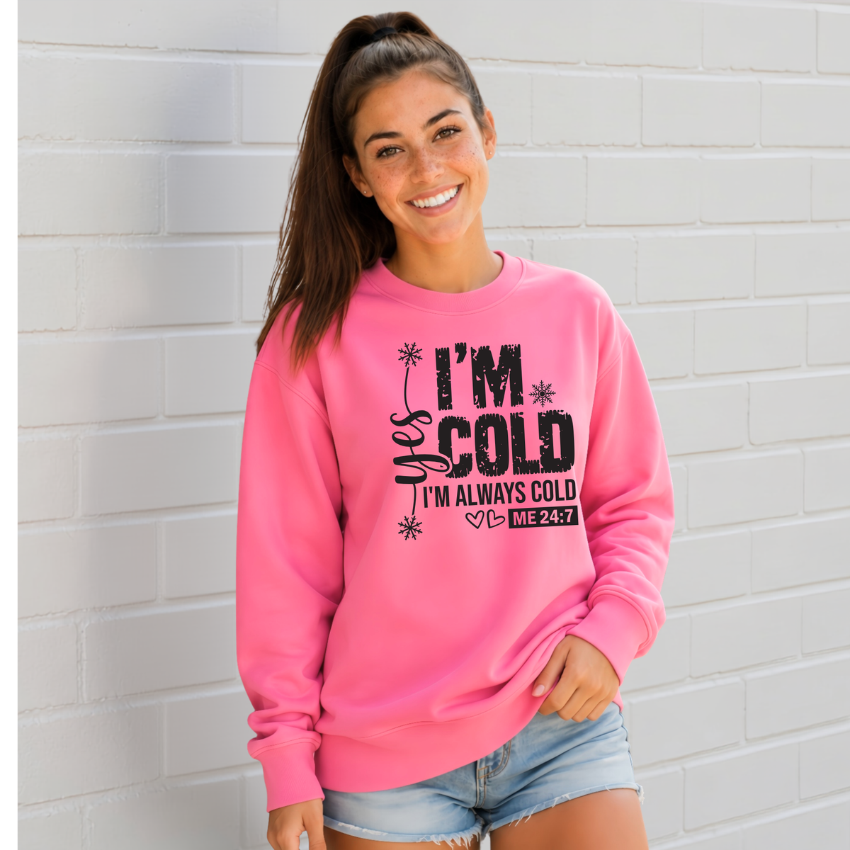 Bright pink crewneck sweatshirt with Yes I'm Cold graphic for women