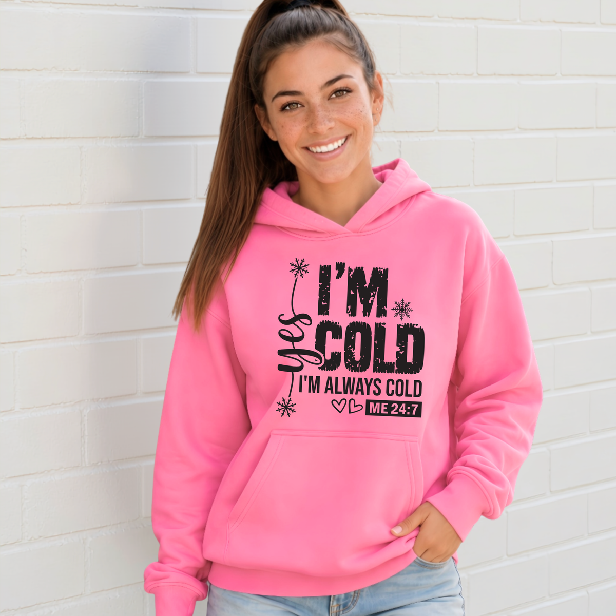 Bright pink hoodie with Yes I'm Cold graphic for women