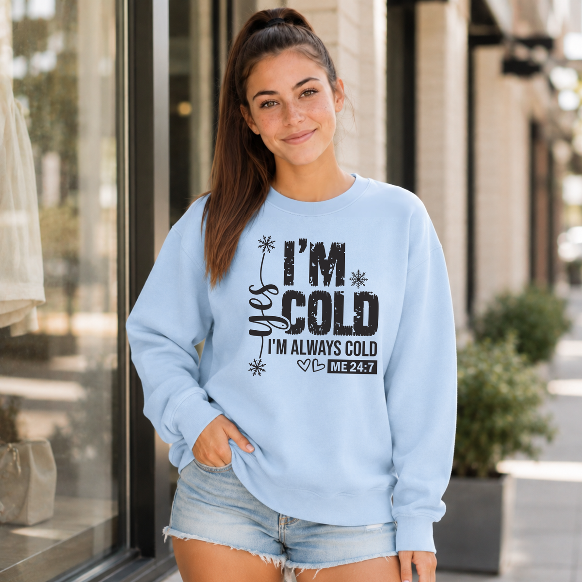 Light blue crewneck sweatshirt with Yes I'm Cold graphic for women